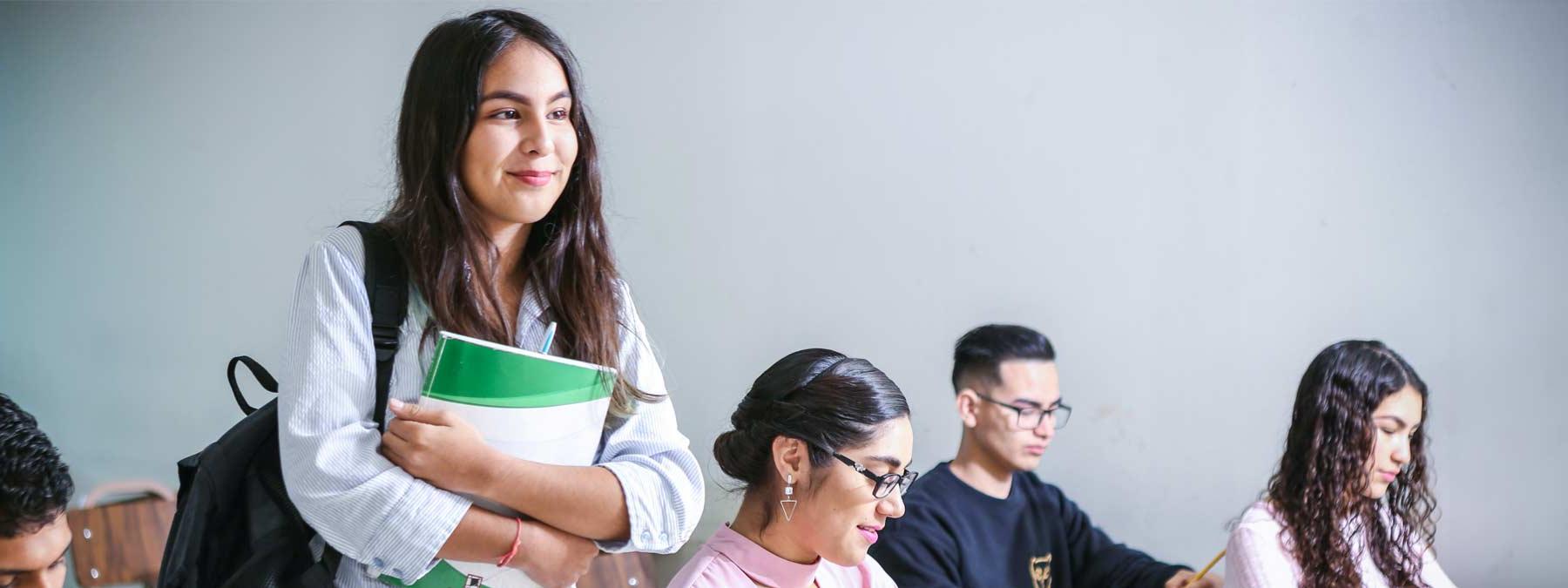 student walking into a classroom